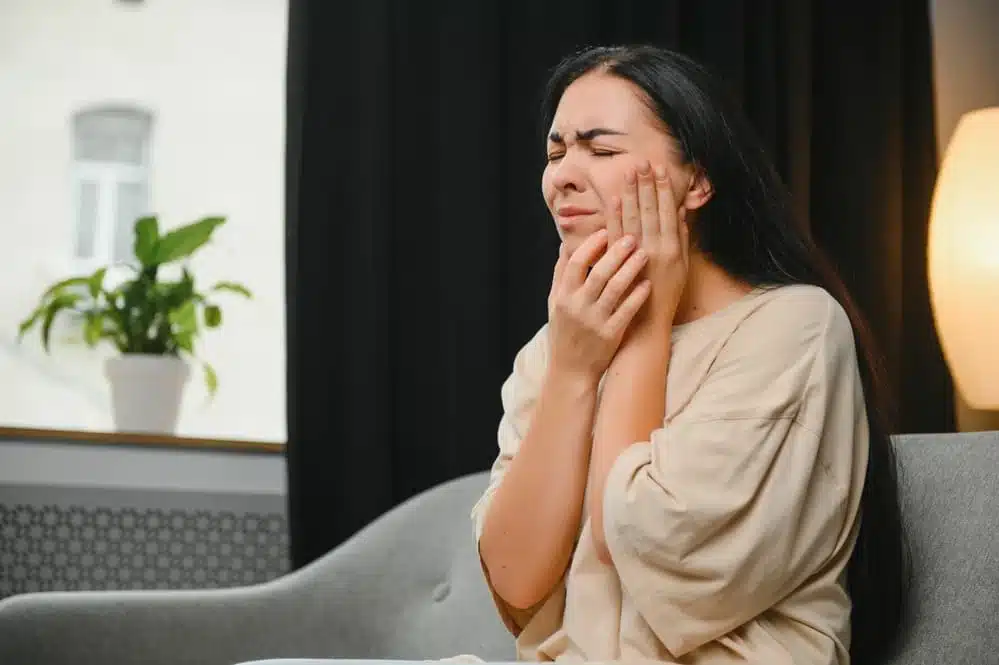 Woman with Severe Toothache Touching Her Swollen Cheek